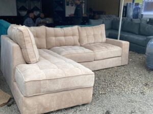Beige tufted corner sofa